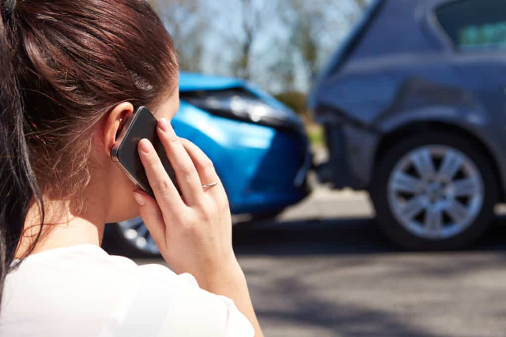 Female Driver Making Phone Call After Traffic Accident